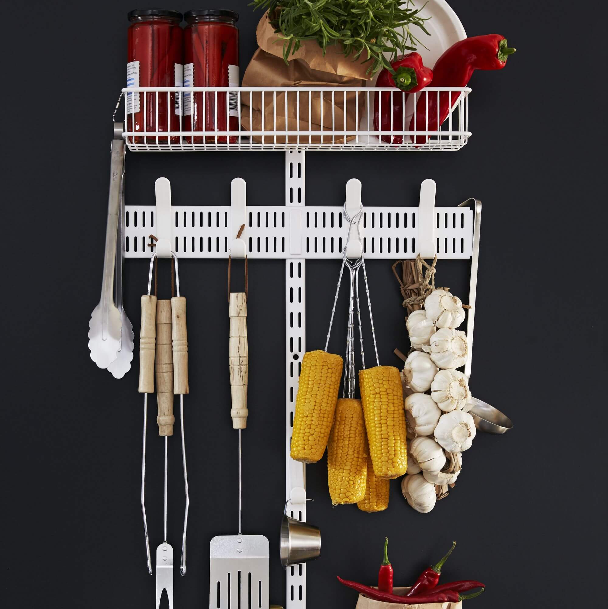 An Elfa Ready Made Solution used in a pantry to store jars and hang utensils