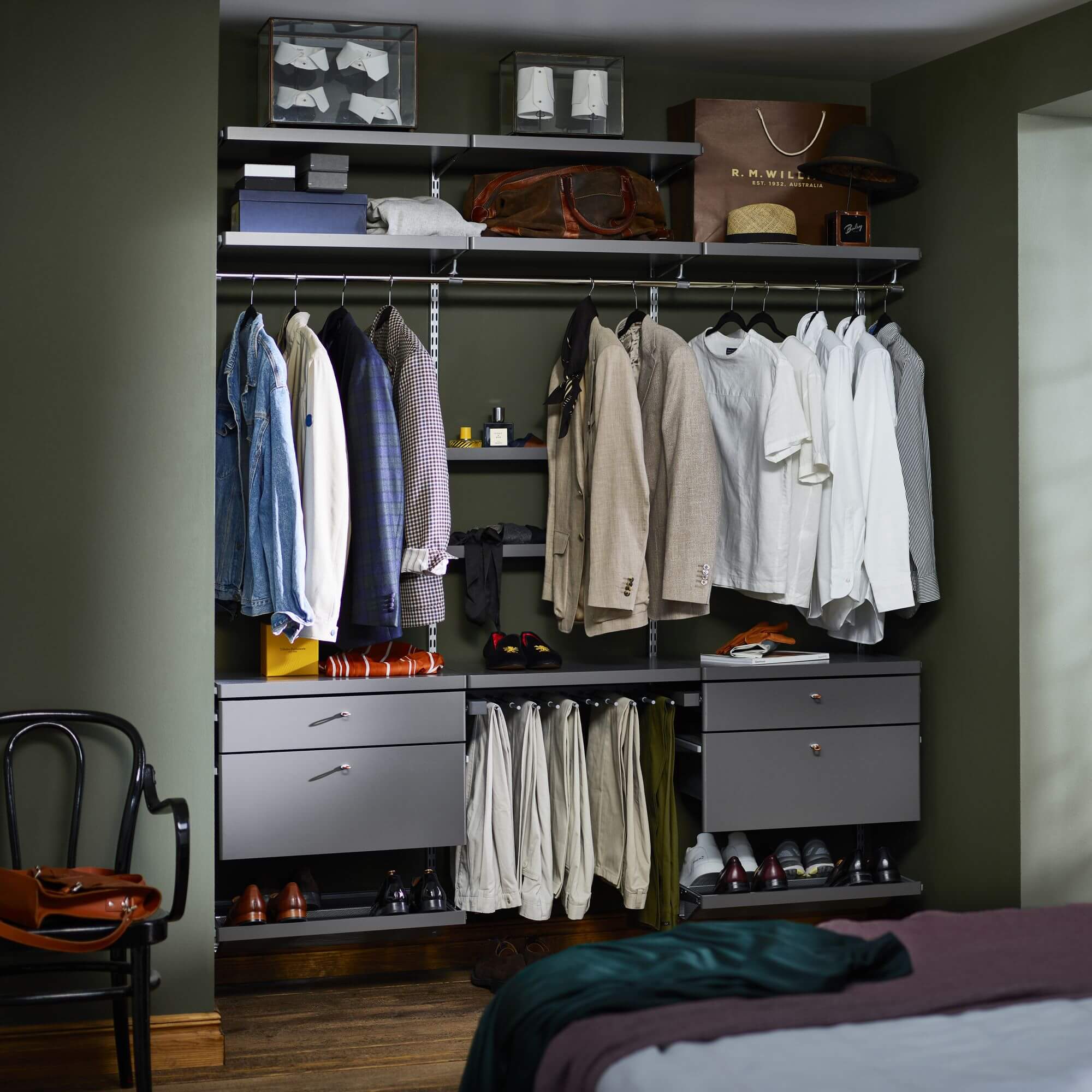 Grey Elfa wardrobe with a clothes hanging rod and timber wardrobe drawers