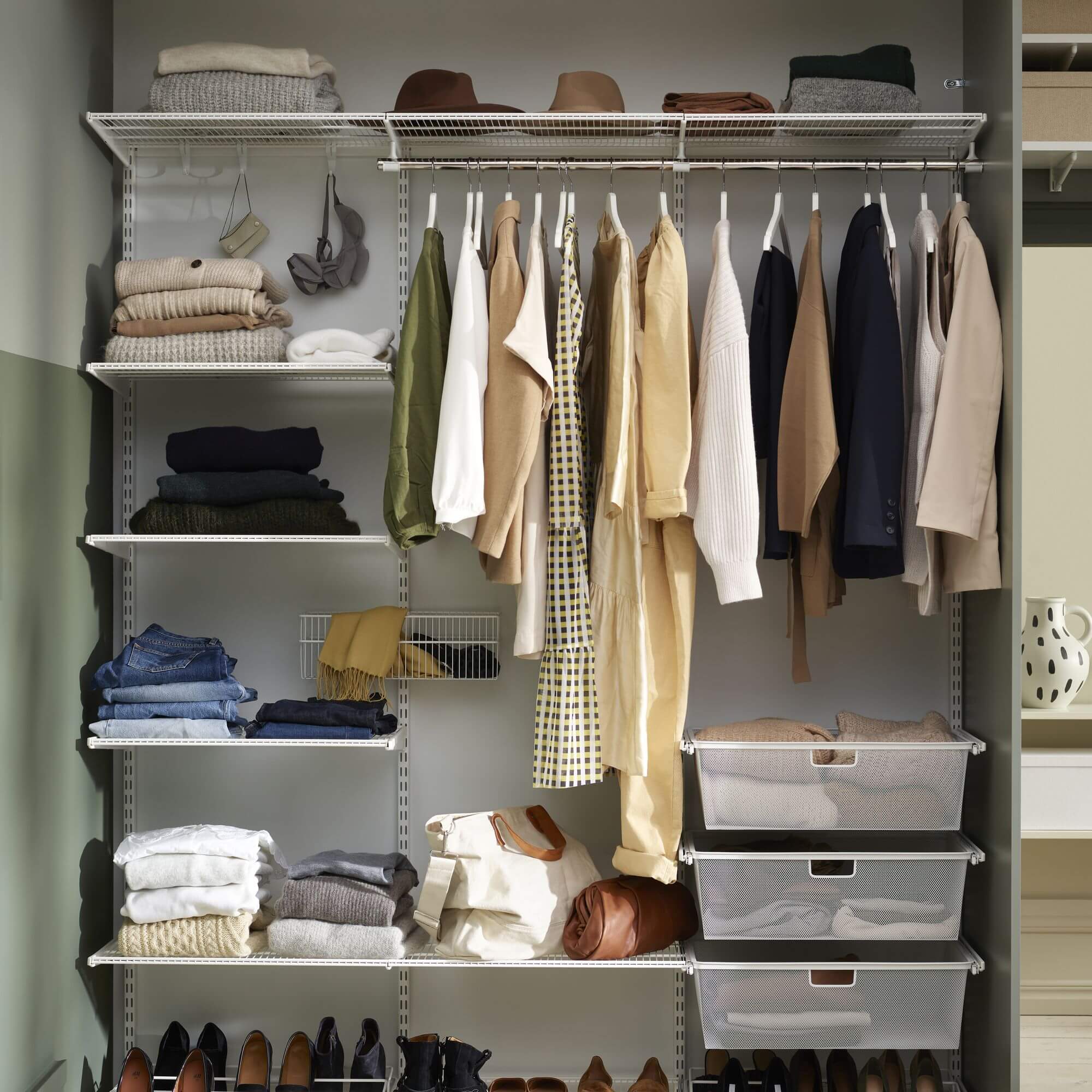 An Elfa wardrobe system with Wire Shelves, Gliding Mesh Drawers and Gliding Shoe Racks