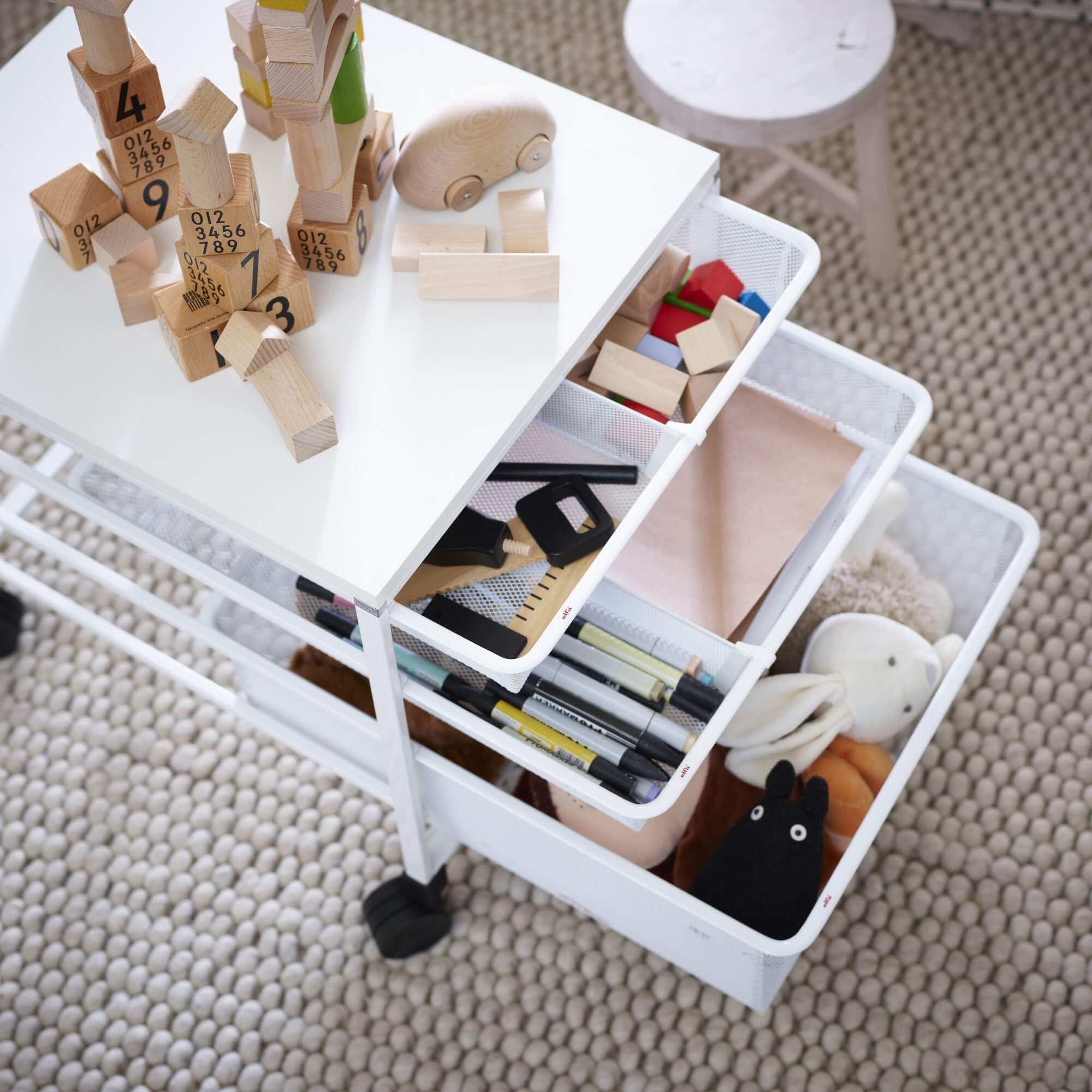 A white Elfa Basics drawer kit used for bedroom storage