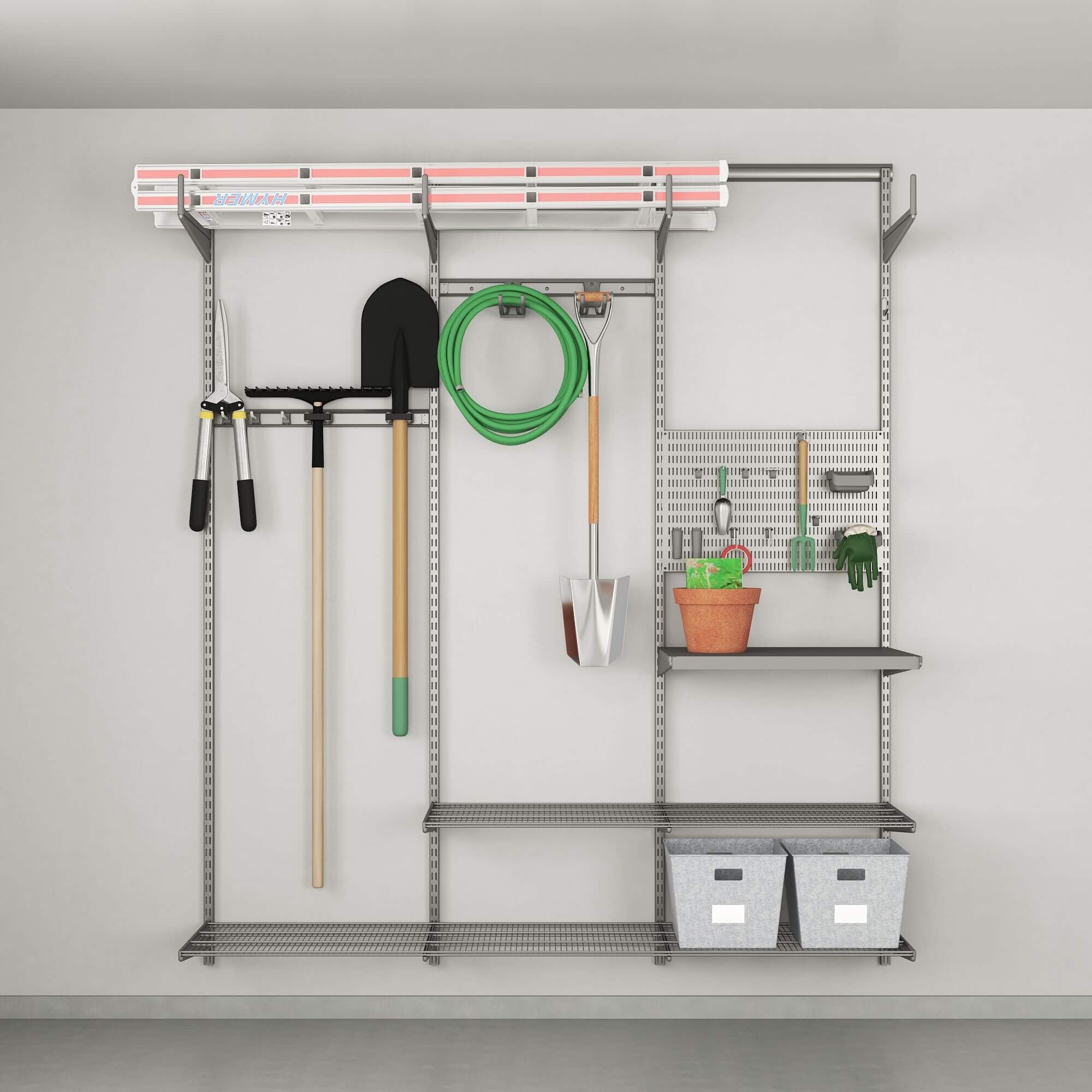 A platinum Elfa garage shelving system with storage boxes and gardening tools stored on it