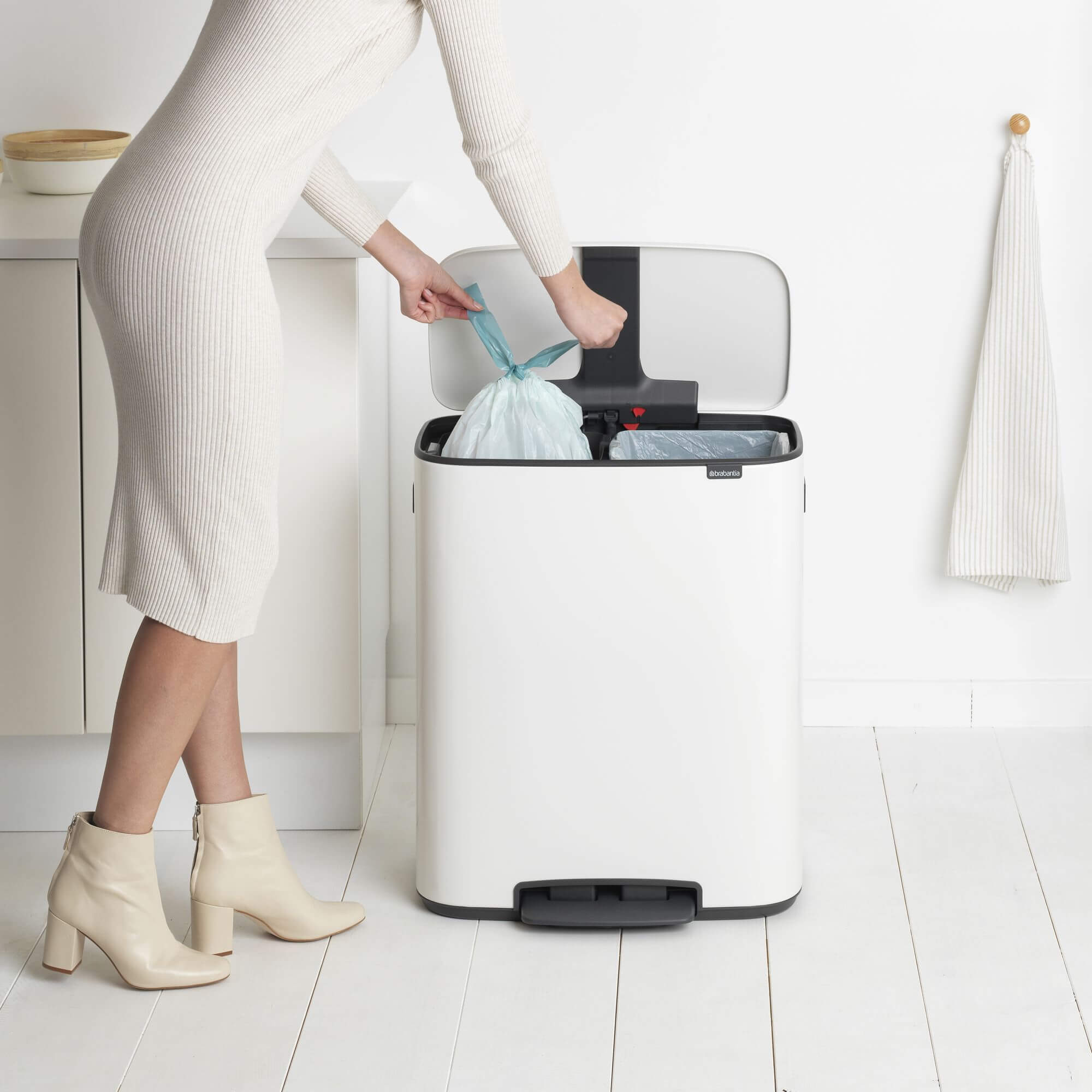 A Brabantia Bo Twin Recycling Bin with one of the two bin liners being changed