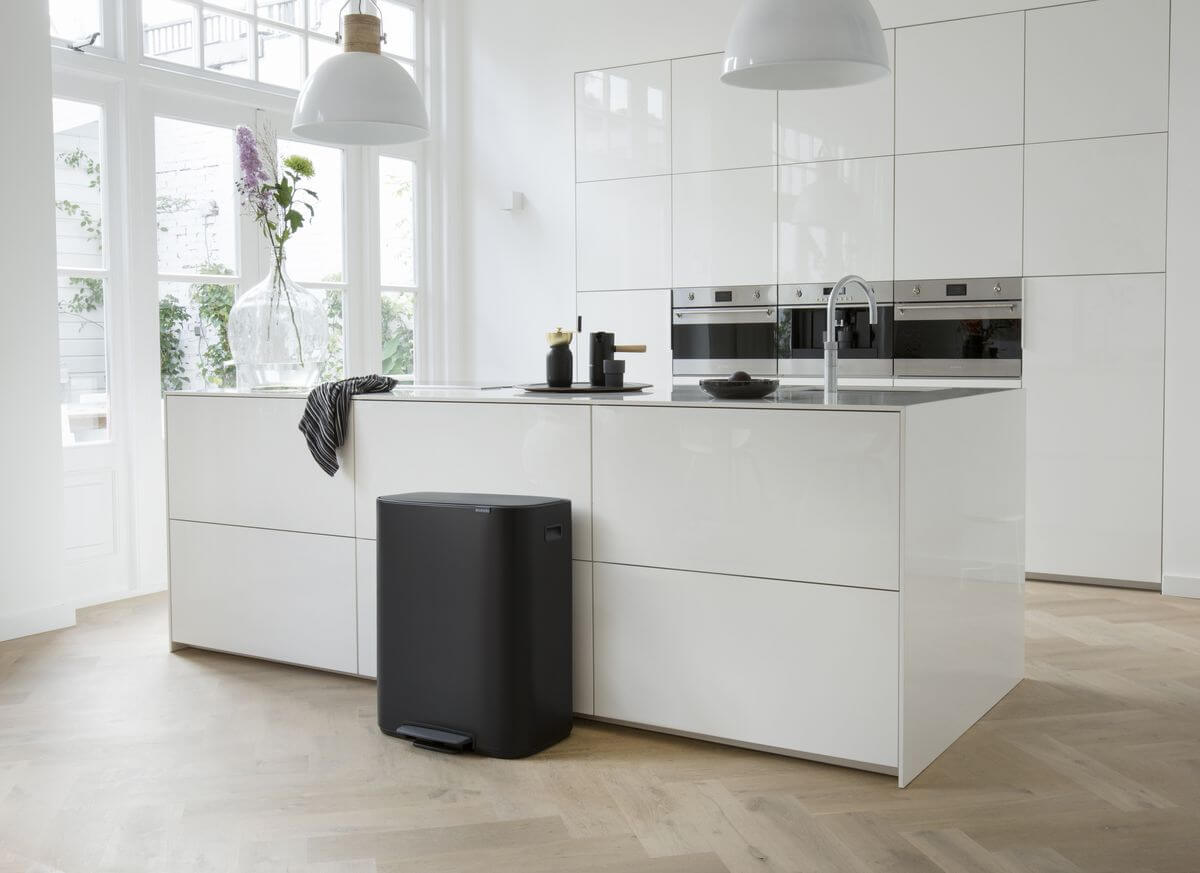 Matte black Brabantia twin kitchen bin in a modern home