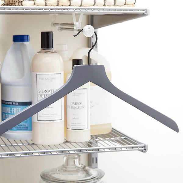 An Elfa Expandable Valet Rod for hanging clothes and ironing