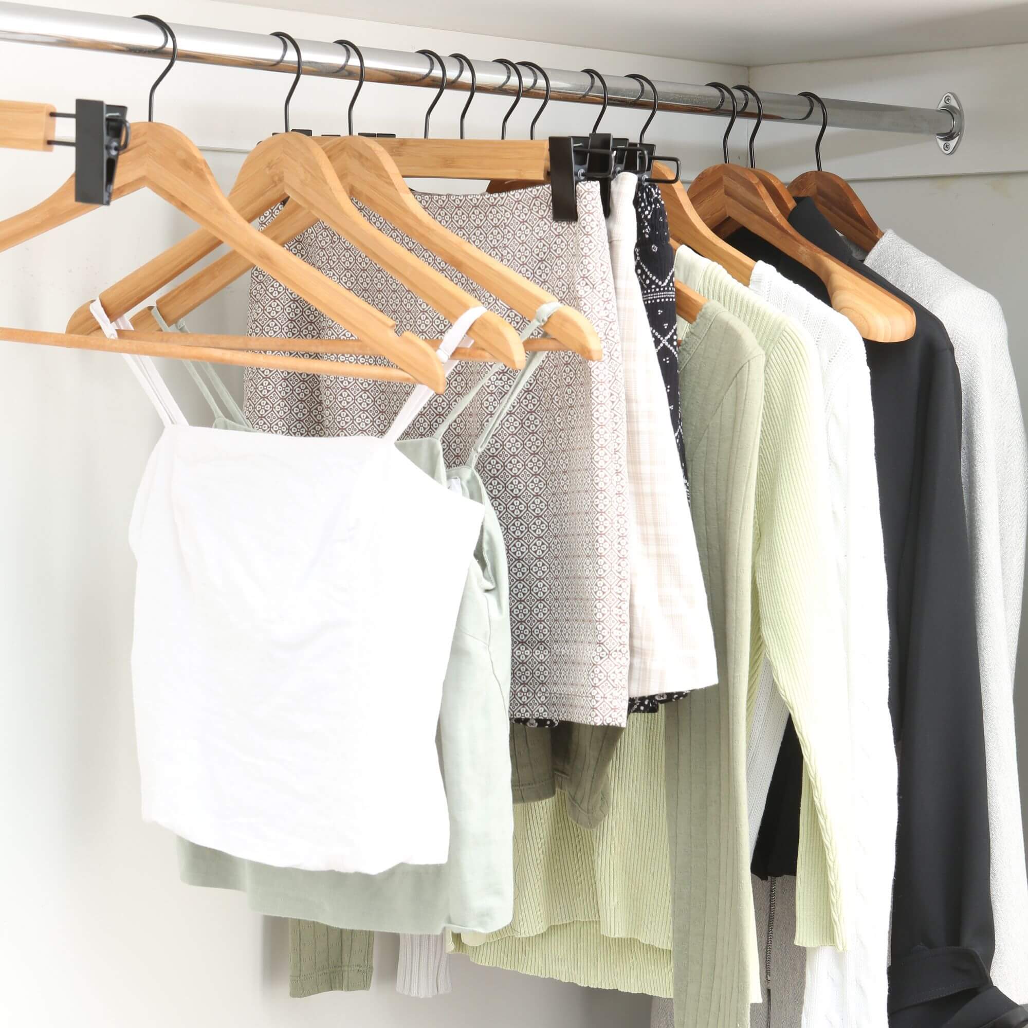Sustainably-sourced bamboo clothes hangers hanging on a rail