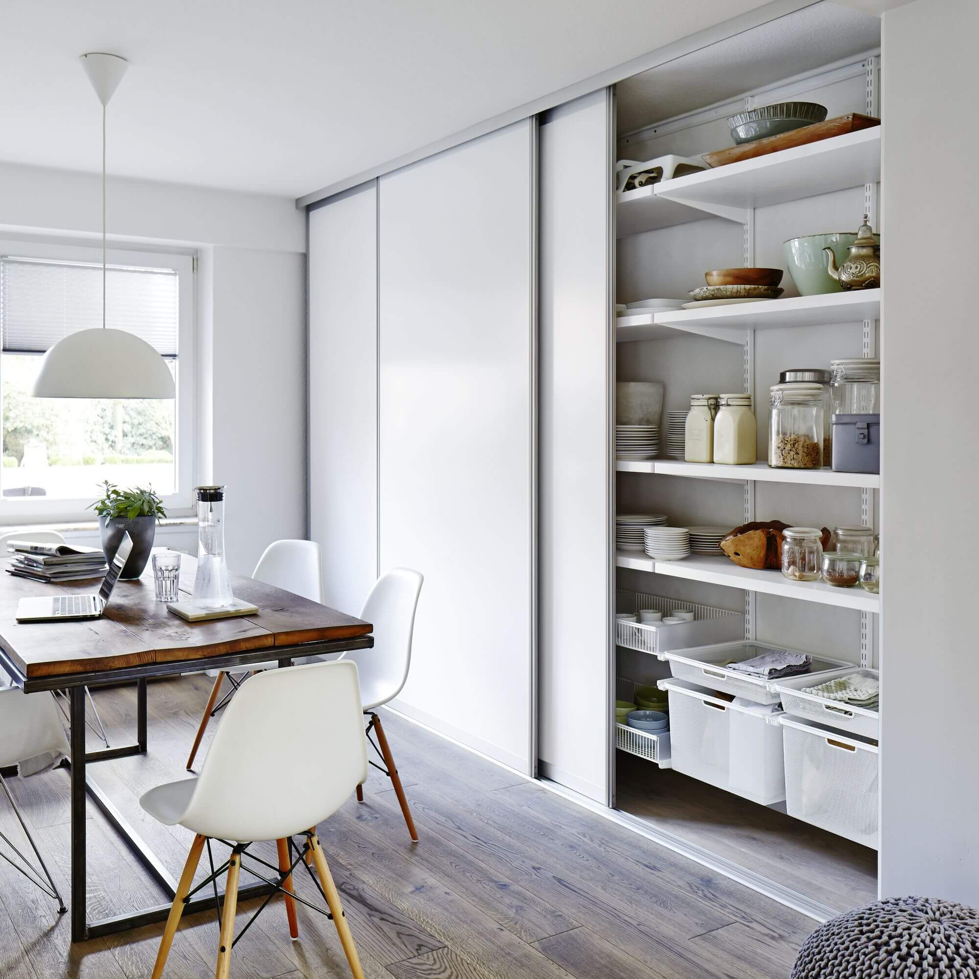 White Elfa pantry shelving with drawers, kitchen containers, pantry shelves and plates
