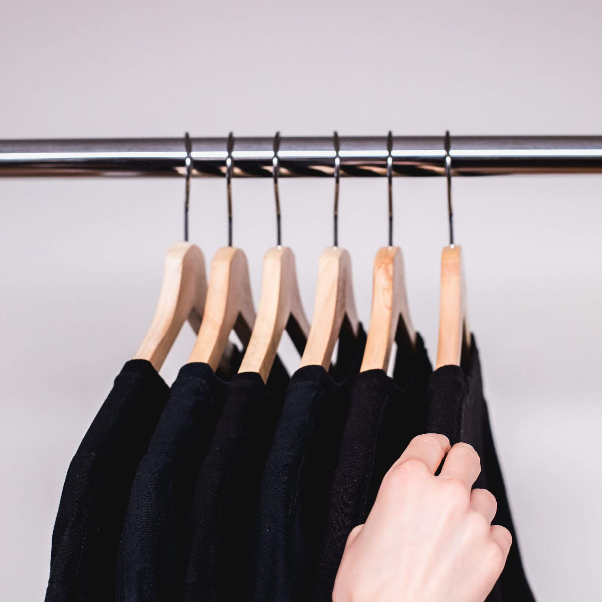 Clothes hanging on moth-repellent cedar clothes hangers