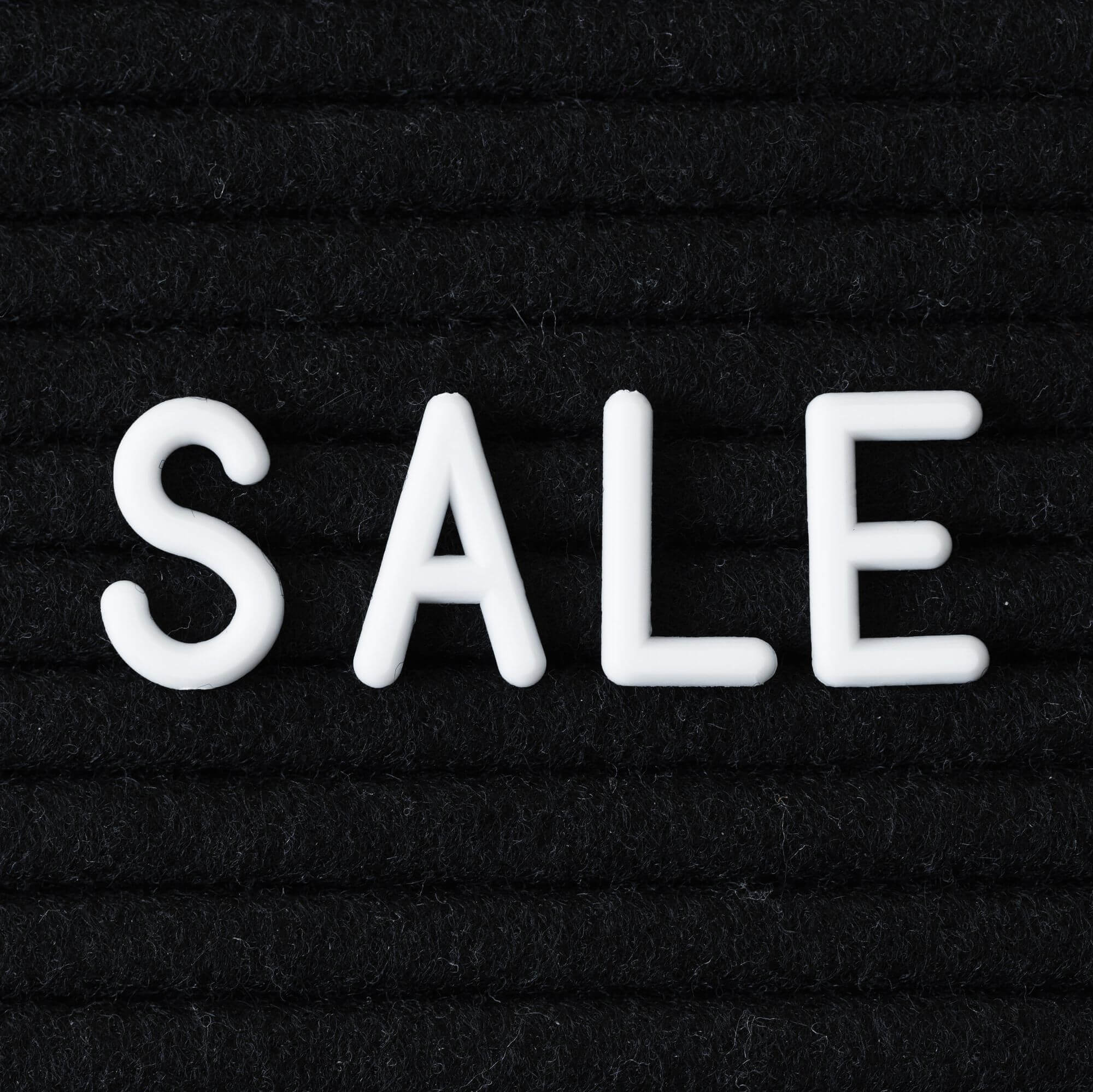 Sale written in white letters on a black background