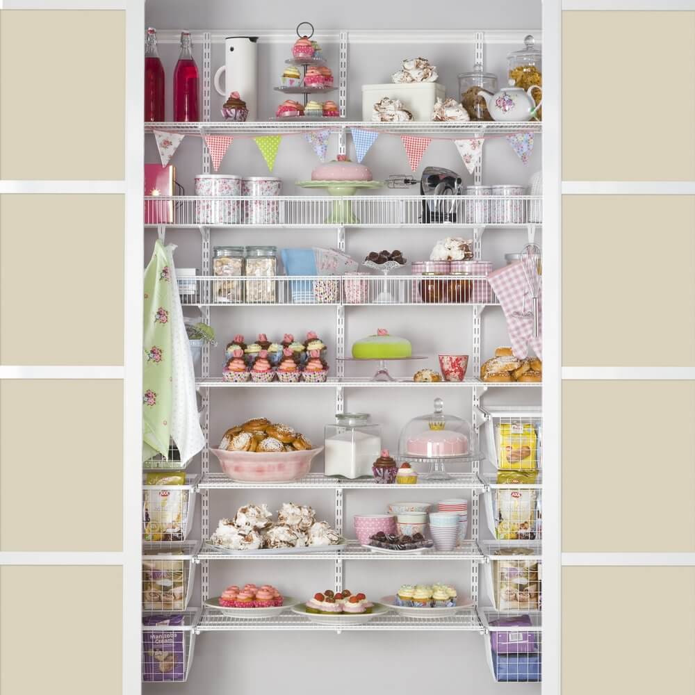White Elfa shelving installed in a kitchen pantry for storing cooking equipment