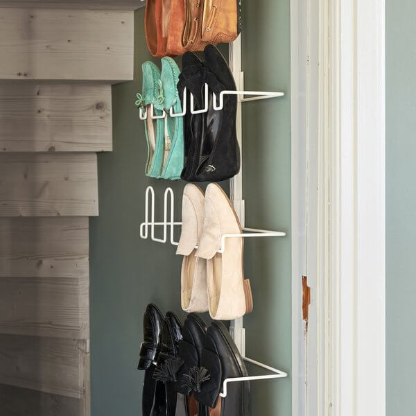 White Elfa Centre Shoe Racks installed as a wall-mounted shoe rack in a wardrobe
