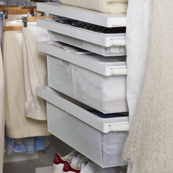 Elfa Decor Drawer Frames with White Mesh Baskets installed in a wardrobe