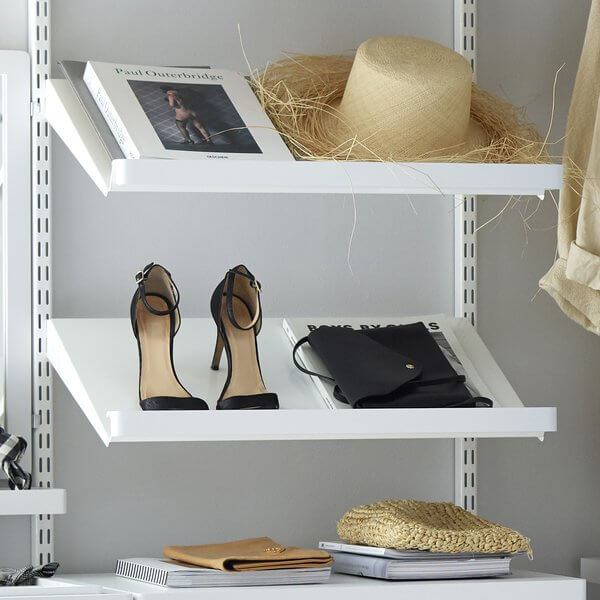White Elfa Decor Shelf Fascias installed on solid metal wardrobe shelving