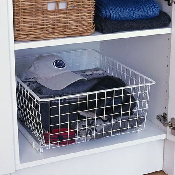 A White Elfa Easy Glider with a Wire Basket, used to turn wardrobe shelves into drawers
