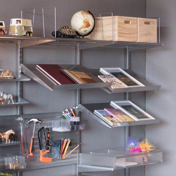 Three Platinum Elfa Angled Metal Shelves installed to organise books and magazines