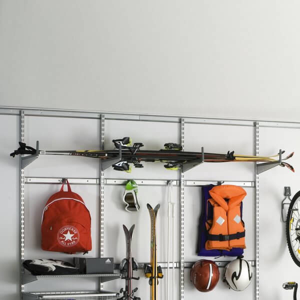Skiing equipment and helmets organised in a Platinum Elfa garage shelving system