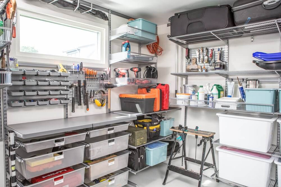 A corner garage installed with Platinum Elfa shelving and Gliding Mesh Drawers