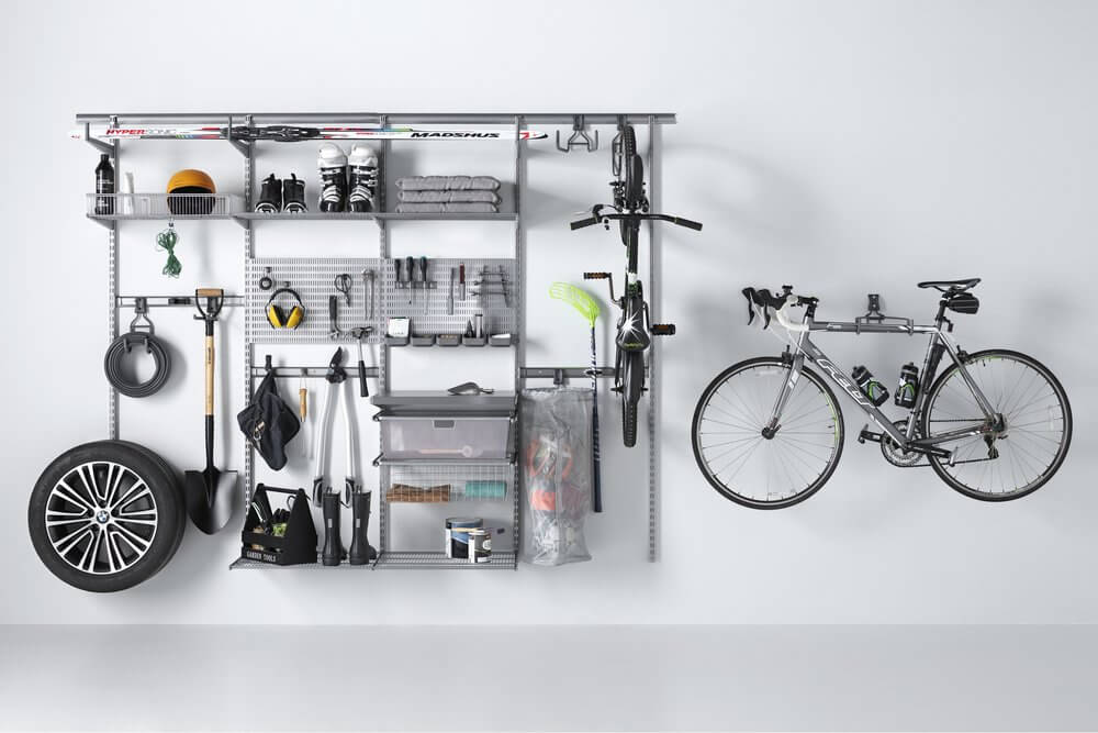 Platinum Elfa shelving organising tools and bicycles on the wall