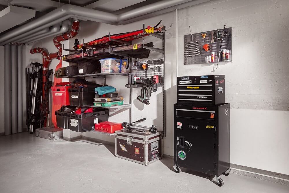 A mechanic's workshop fitted out with Platinum Elfa shelving to organise tools and skiing equipment
