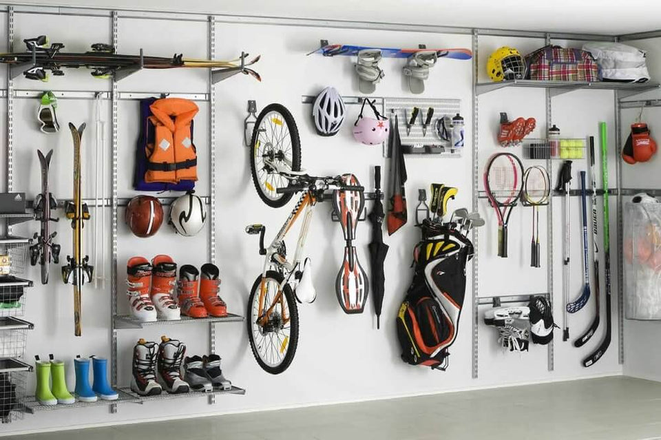 Bikes and sports equipment stored on a Platinum Elfa garage shelving system