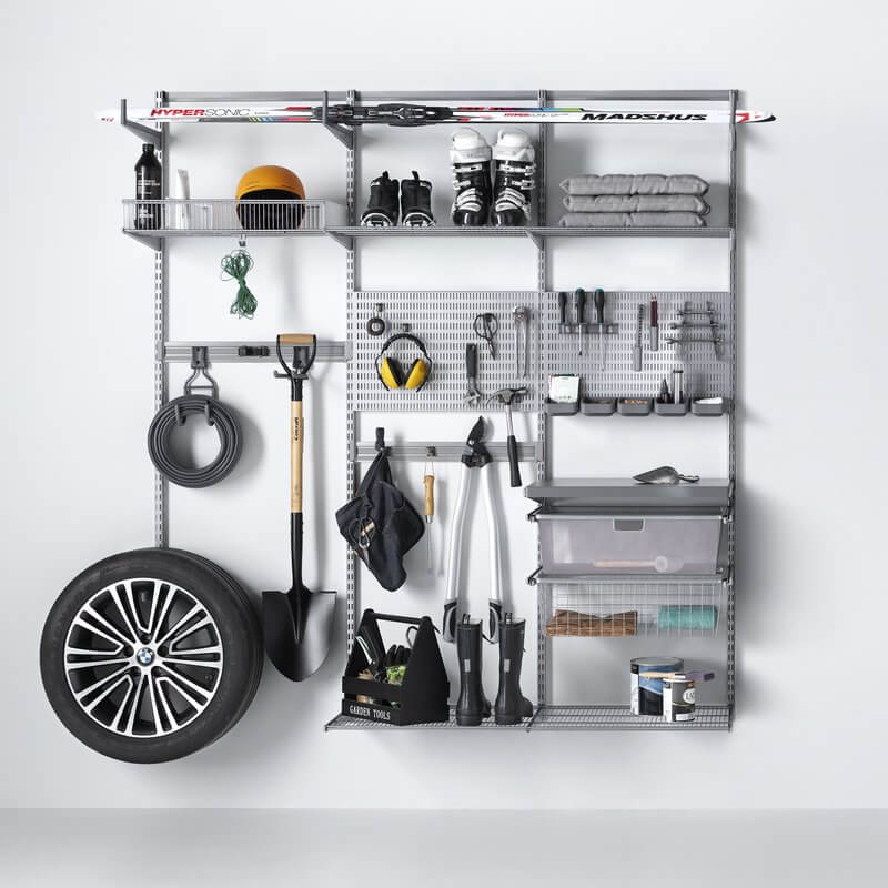 Platinum Elfa shelving organising tools and storing garage equipment like shovels and car wheels