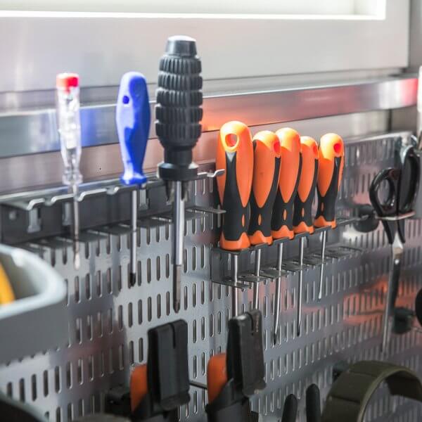 Screwdrivers and scissors stored on a Platinum Elfa Storing Board