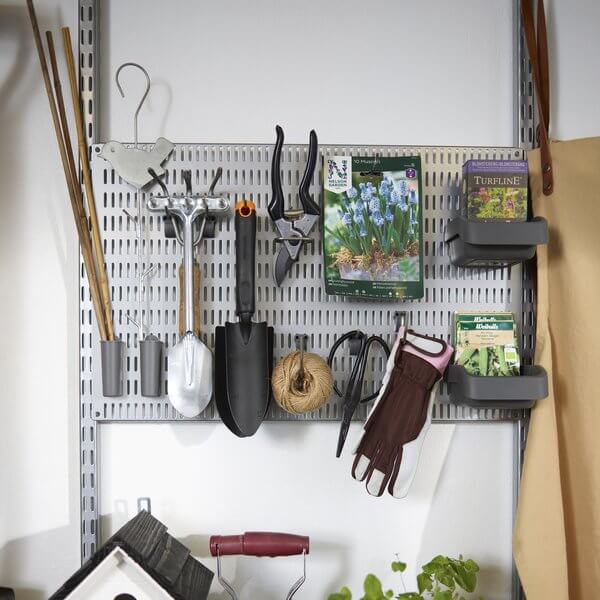 Garden stakes, gloves and secateurs stored on a Platinum Elfa Storing Board