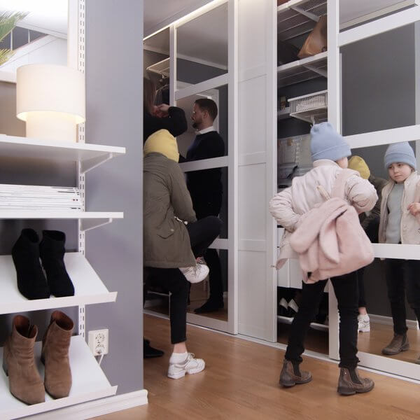 White Elfa storage for shoe storage and clothes organisation