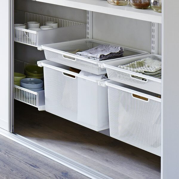 White Elfa Gliding Mesh Drawers installed in a built-in pantry