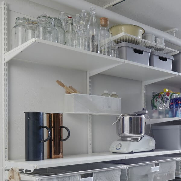 White Elfa Click In Melamine Shelves installed in a pantry to organise glassware, appliances and pantry containers