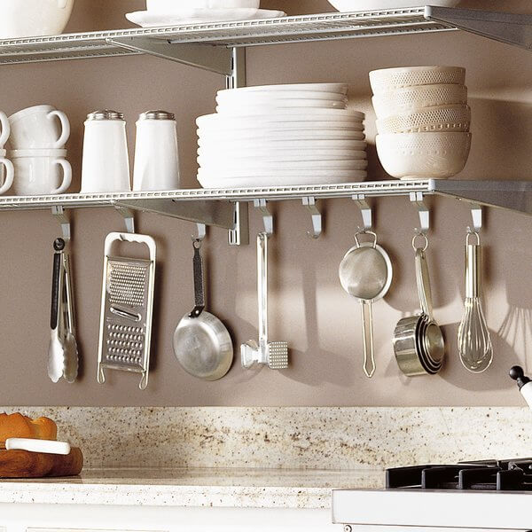 Platinum Elfa Shelf Hooks installed under Elfa Wire Shelves, organising utensils above a kitchen bench