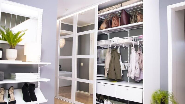 Clothes organisation with Elfa shelving, with White Decor wooden shelves and Decor Drawer Fronts