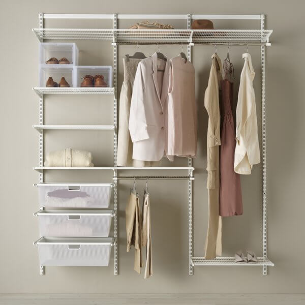 A white Elfa wardrobe storage system organising clothes