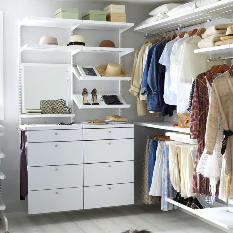 An Elfa wardrobe storage system with White Decor shelving and drawers