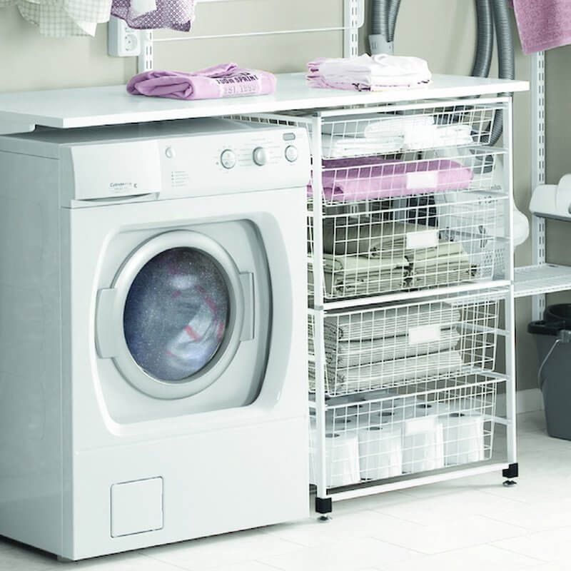 A White Elfa Freestanding Drawer Kit with Wire Drawers installed in a laundry room